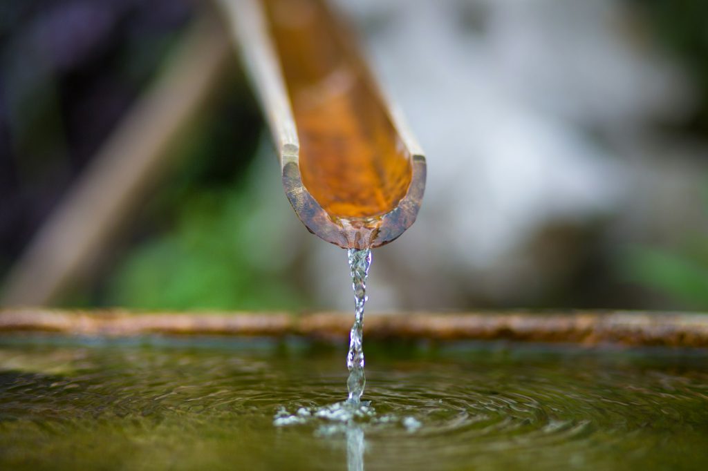 bamboo fountain with water in a temple